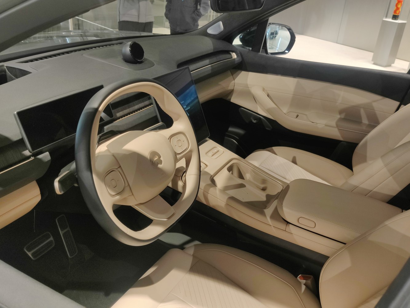 Beige leather interior with digital dashboard and advanced steering controls