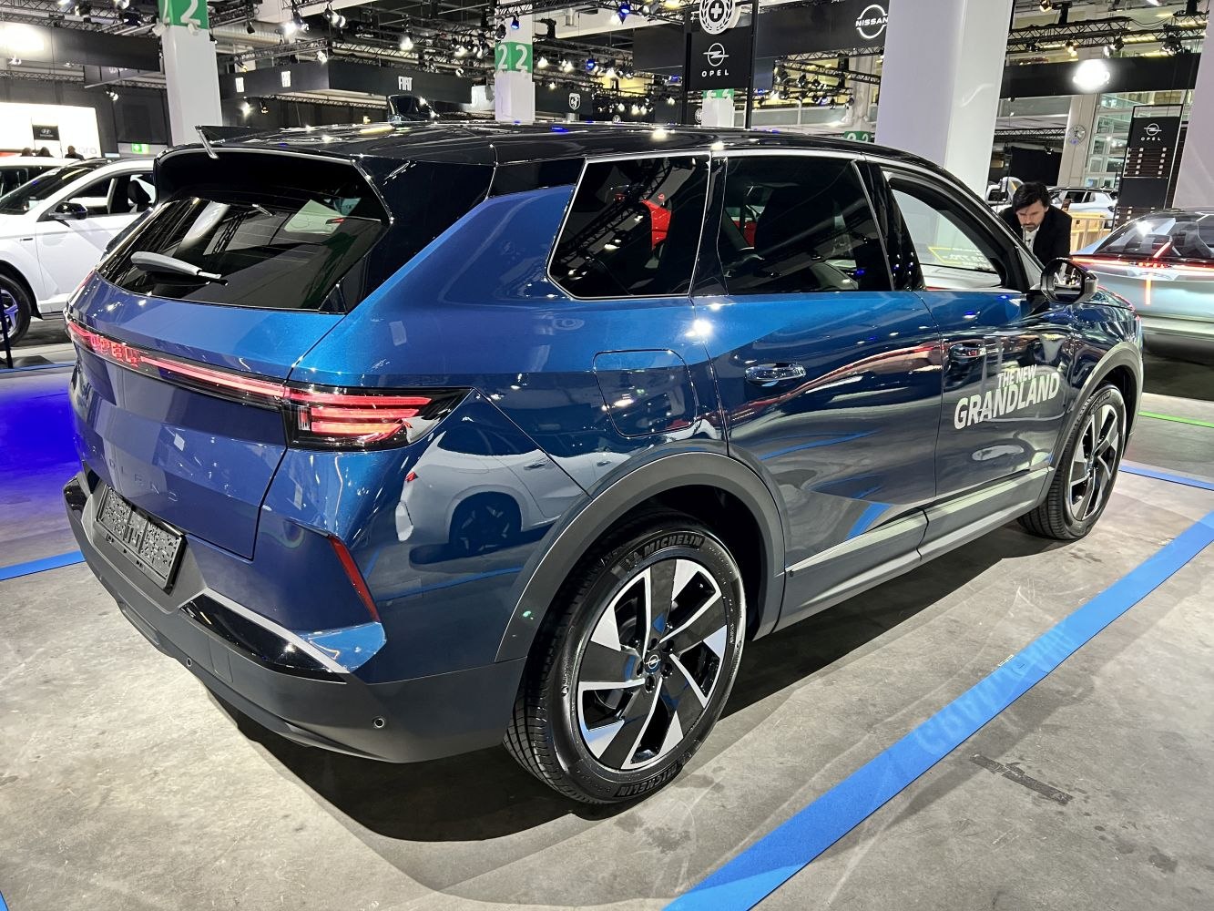 Rear and side profile of metallic blue SUV with LED taillights and alloy wheels