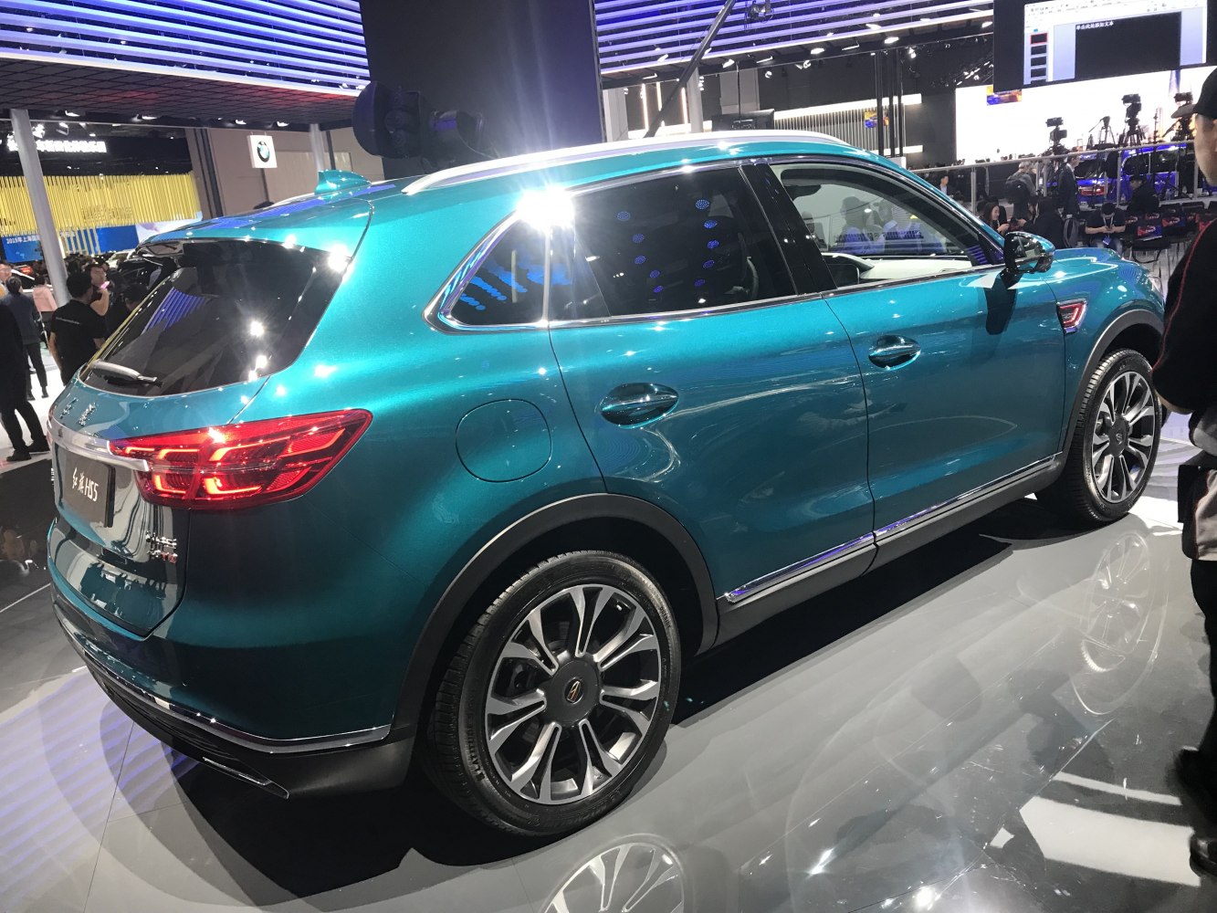 Rear side view of sleek modern SUV with LED tail lights and alloy wheels.
