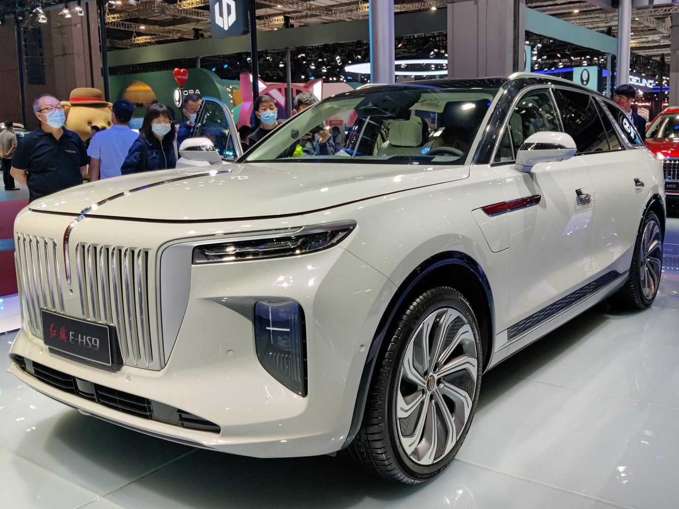 Luxury white SUV with distinctive vertical grille and wide LED headlights