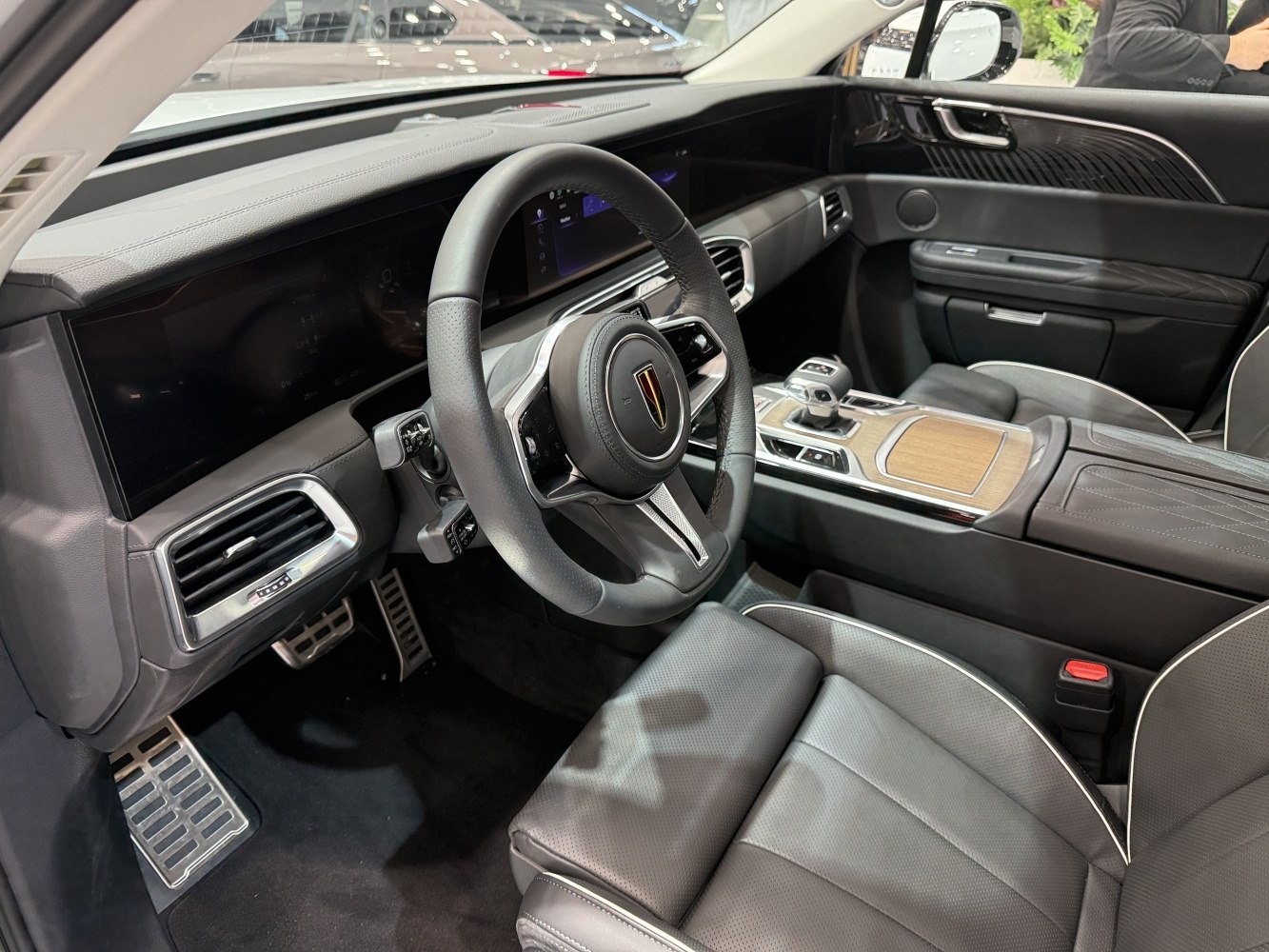 Modern luxury car interior with digital display and leather seating