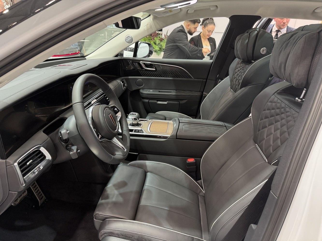 Quilted leather seats and modern luxury dashboard with wood trim