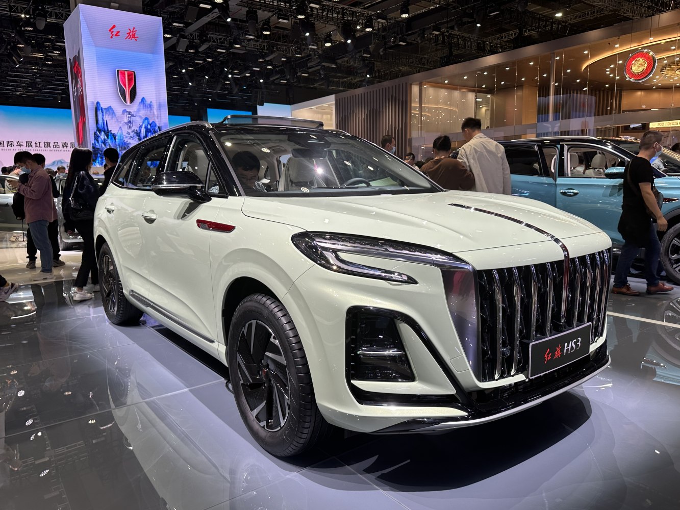 Prominent vertical grille and sleek LED headlights on an SUV front.