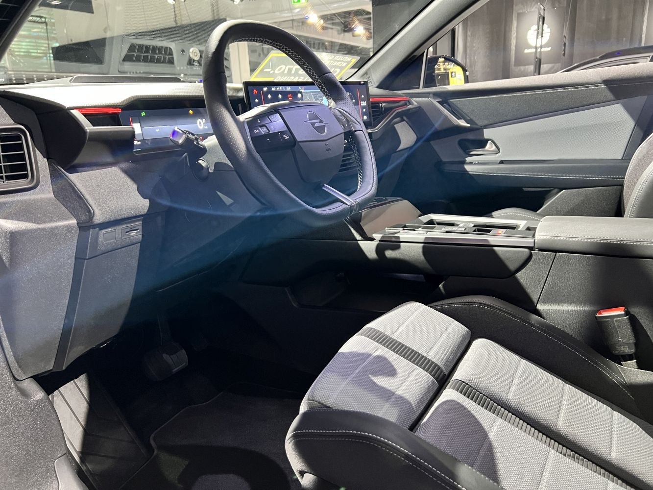 Modern digital cockpit and multifunction steering wheel in car interior