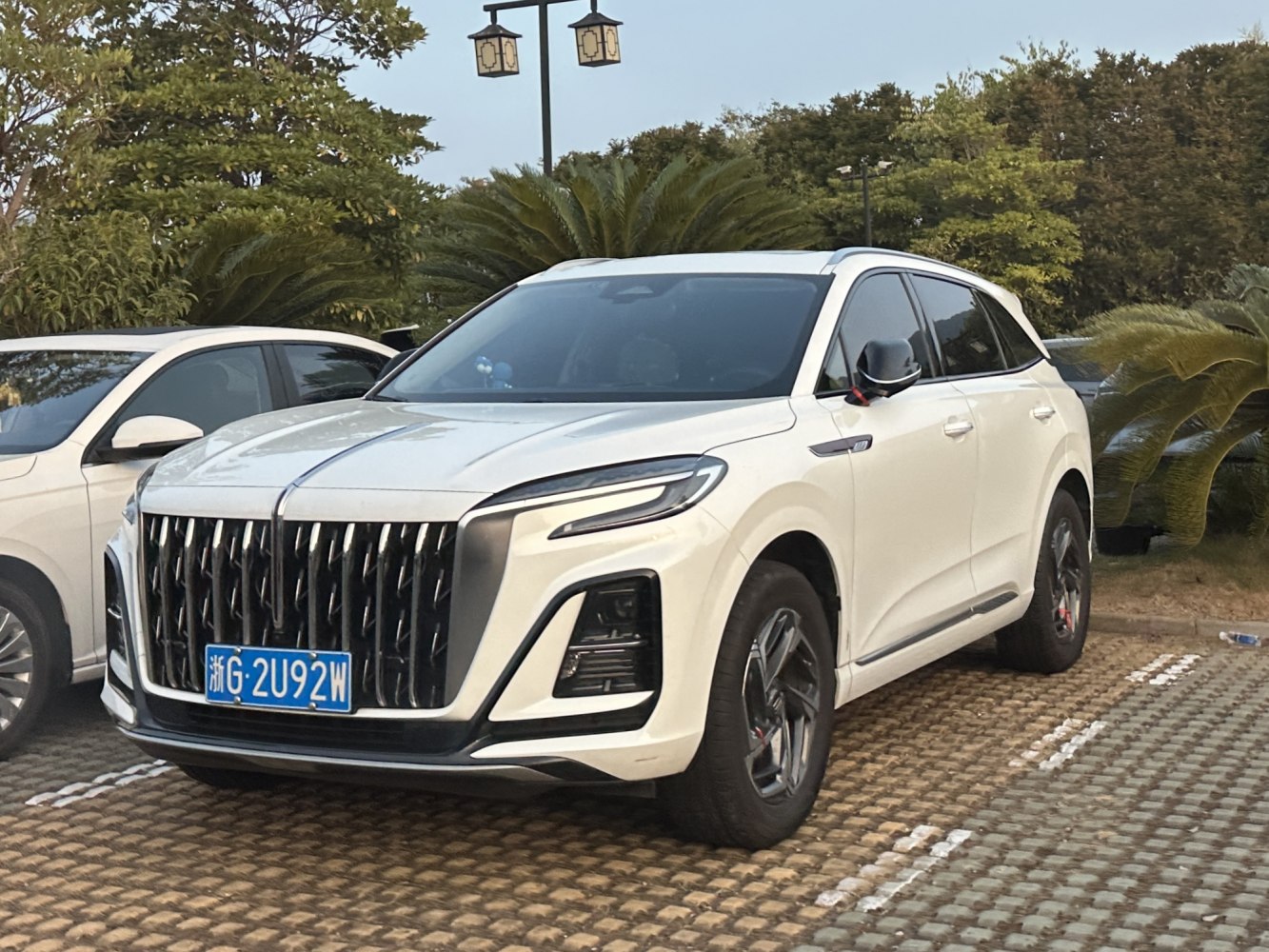 Large vertical grille and sleek LED headlights on a modern SUV.