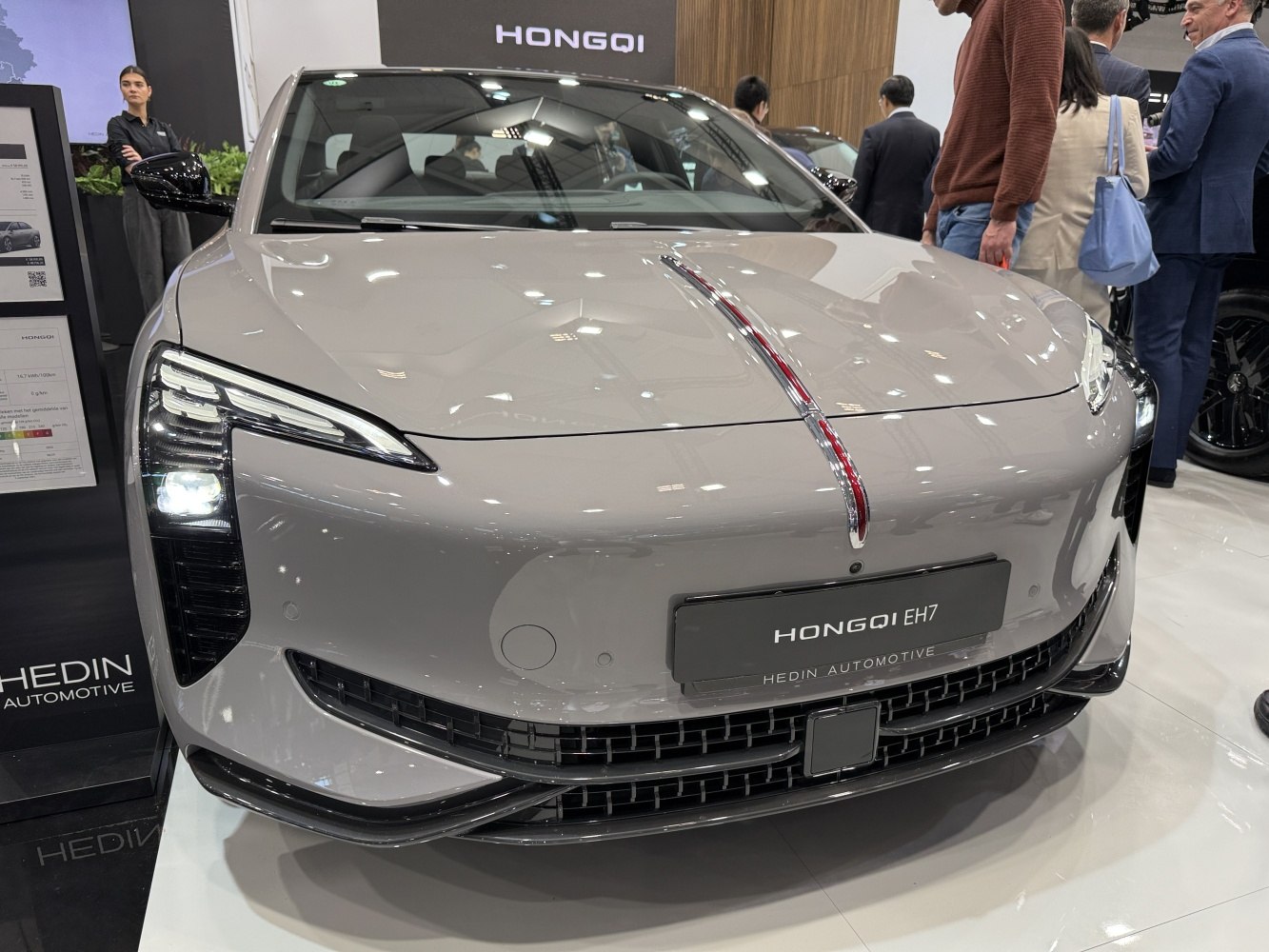Front view with distinctive LED headlights and sleek grille design.
