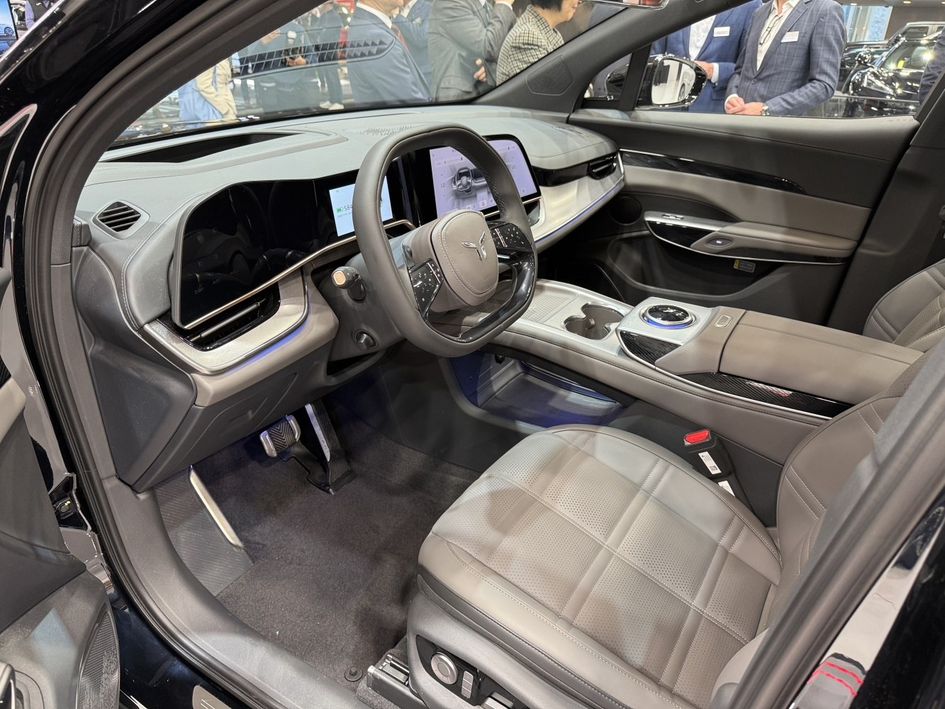 Luxury car interior with dual digital displays and leather seating