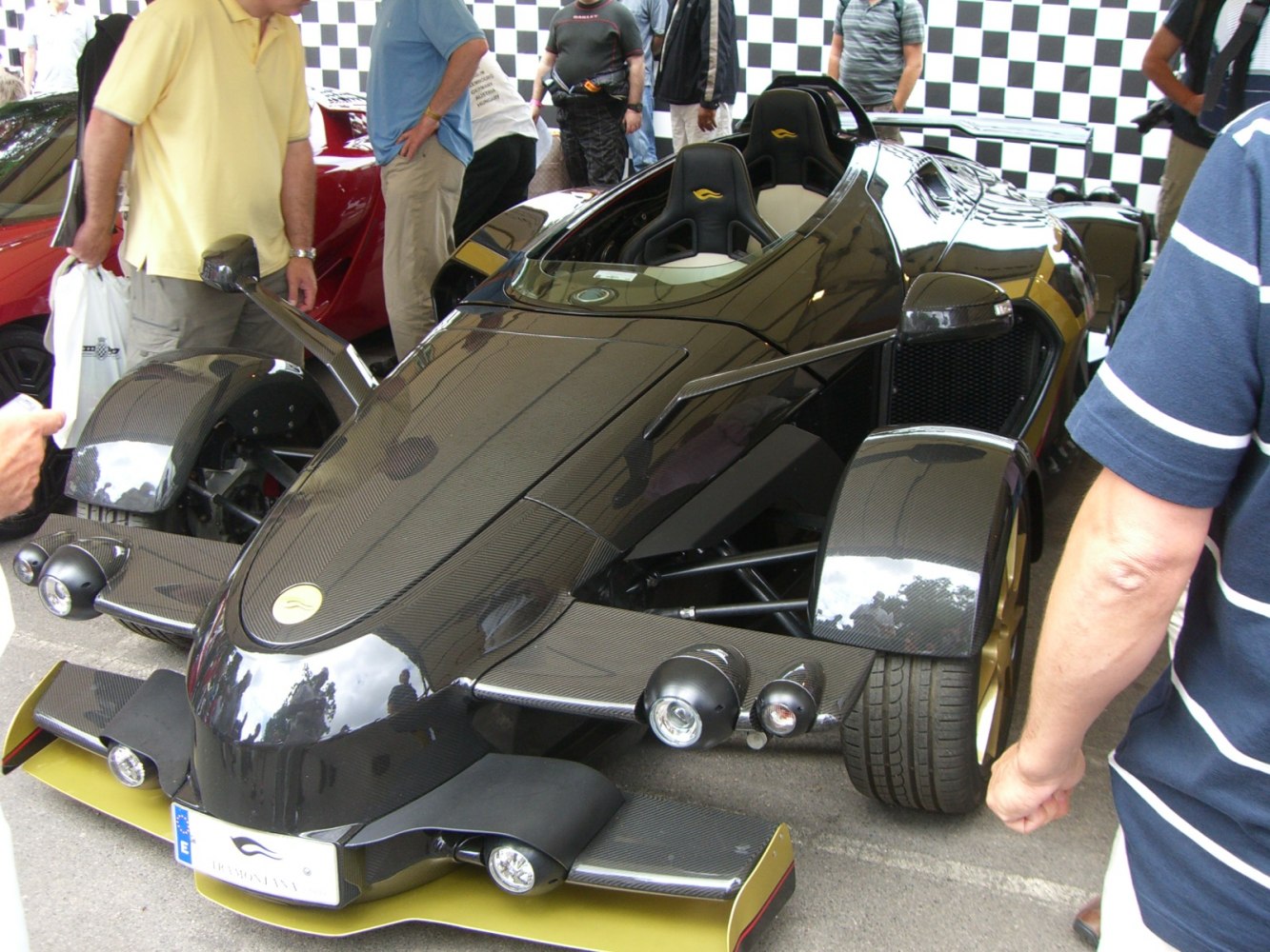 Open-wheel supercar with carbon fiber body and racing seats