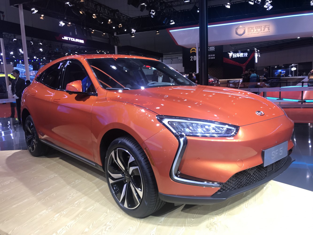 Electric SUV with futuristic LED headlights and sleek aerodynamic design