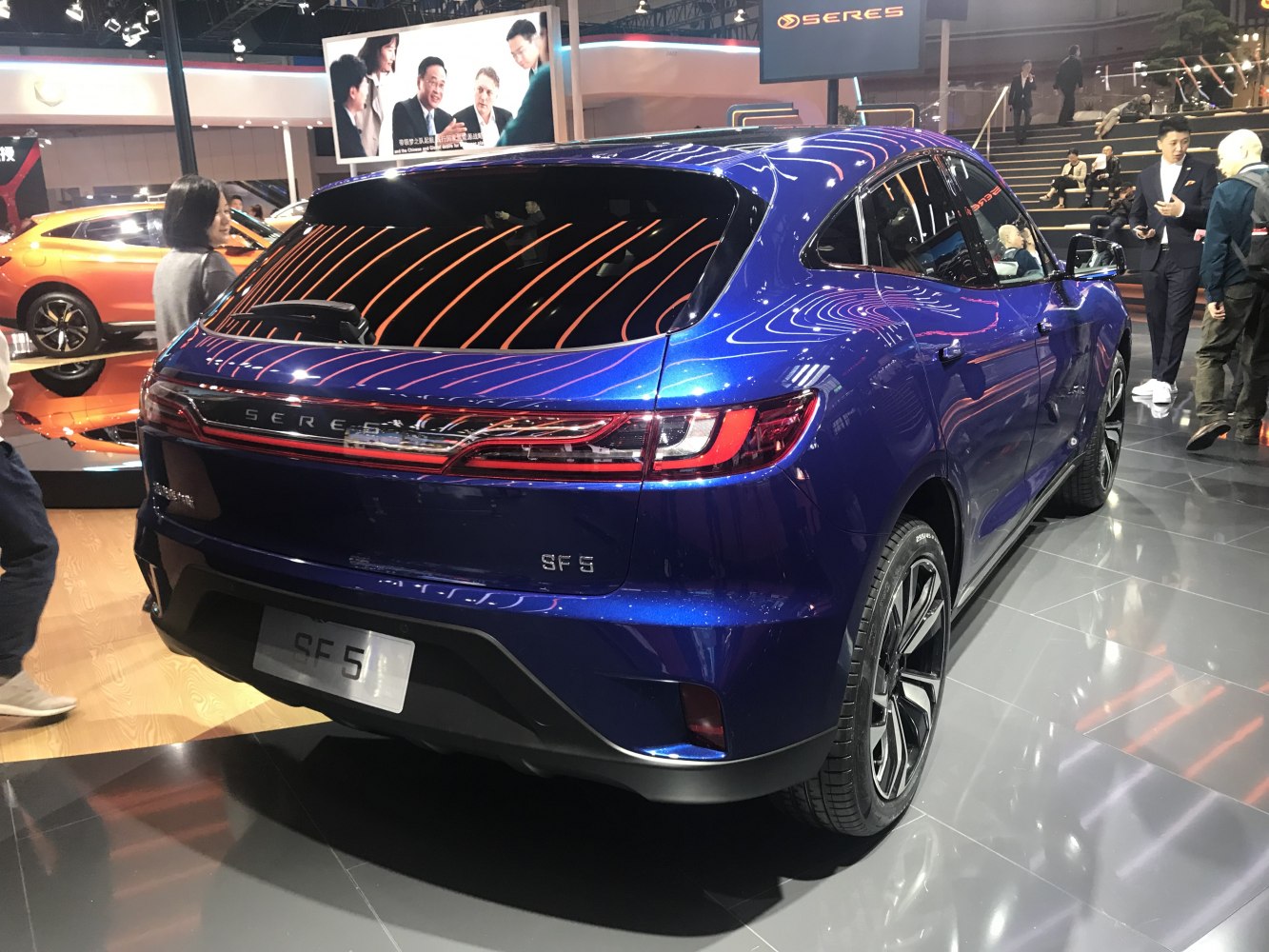 Rear view showcasing sleek tail lights and aerodynamic electric SUV design.