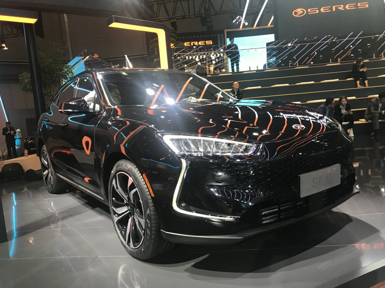 Front and side view of a modern black electric SUV with LED headlights