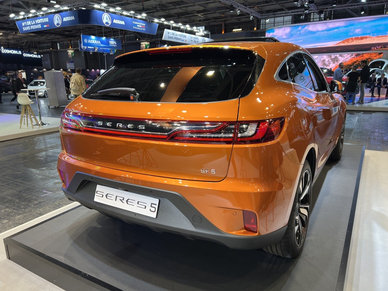 Rear view of electric SUV highlighting LED taillights and sporty rear design.