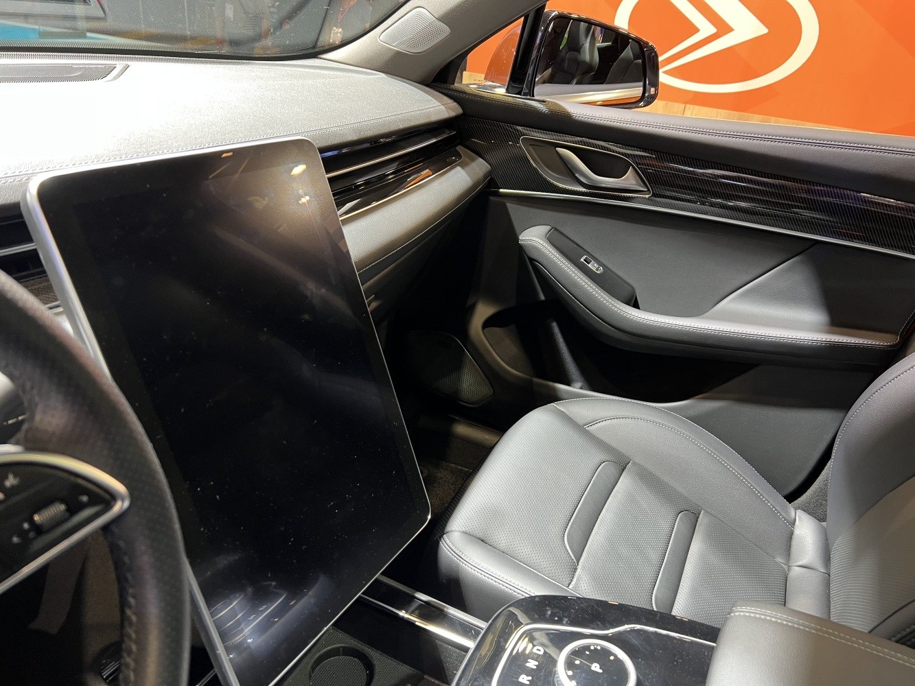 Large vertical touchscreen infotainment and premium dashboard design