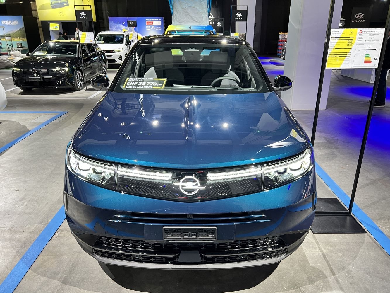 Front view of a vehicle with LED headlights and modern grille