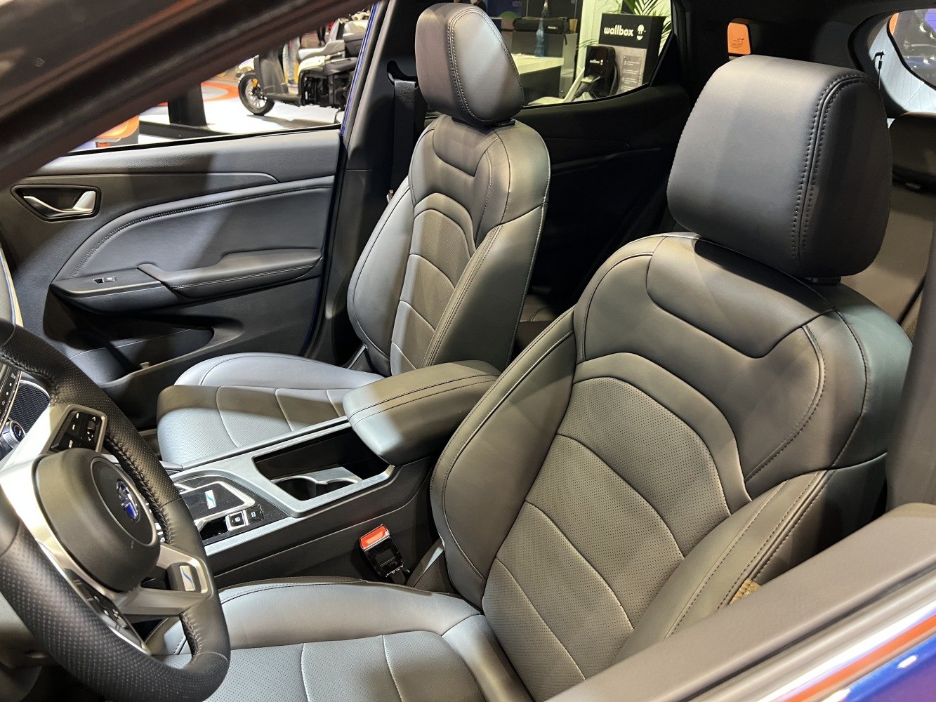 Leather front seats and dashboard interior with center console.