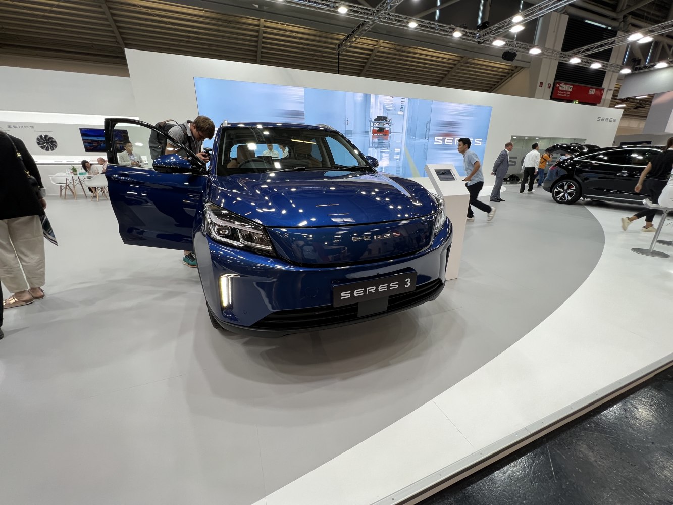 Front view of electric SUV with LED headlights and vertical DRLs