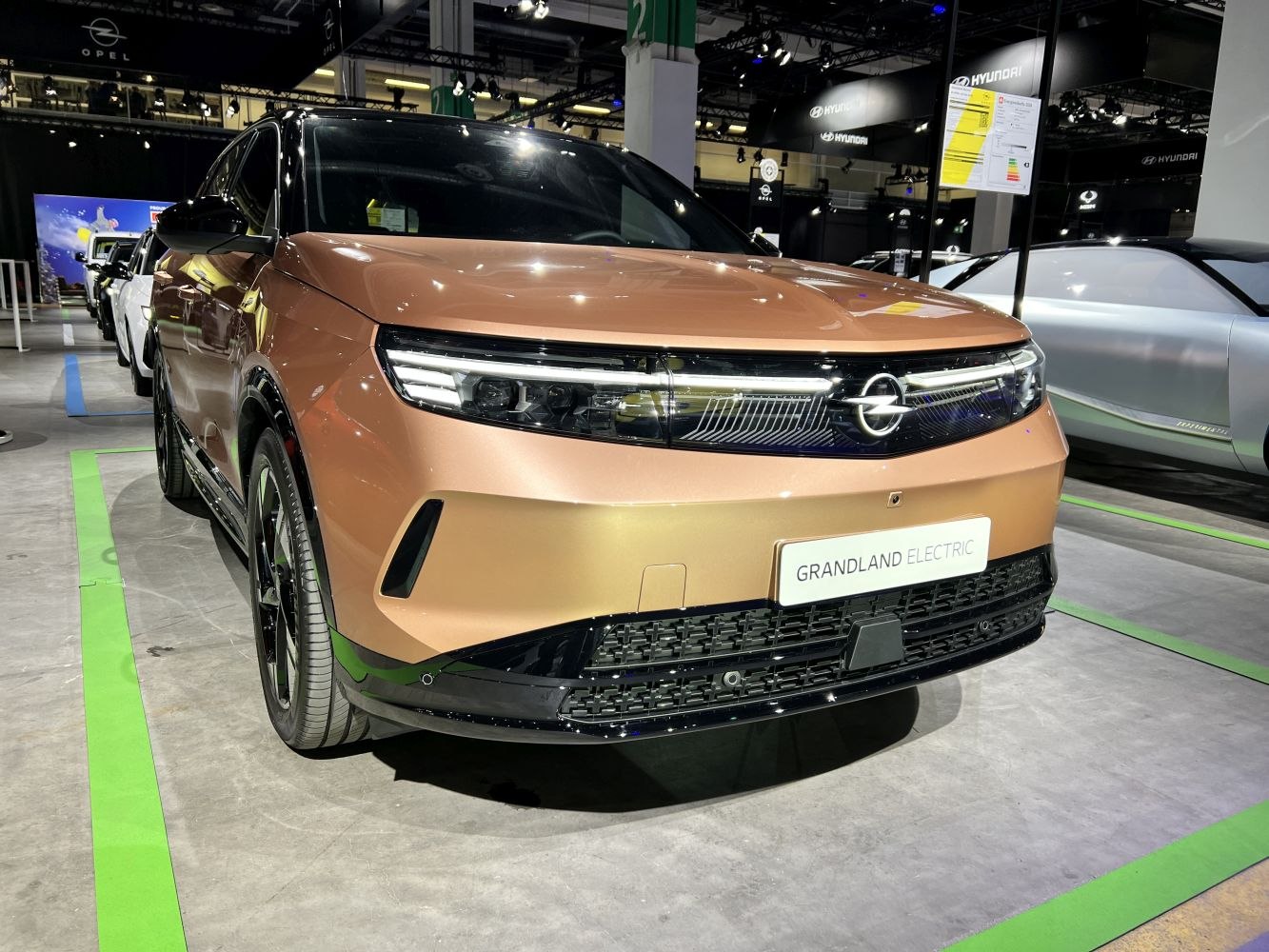 front view of electric SUV with LED headlights and bold grille