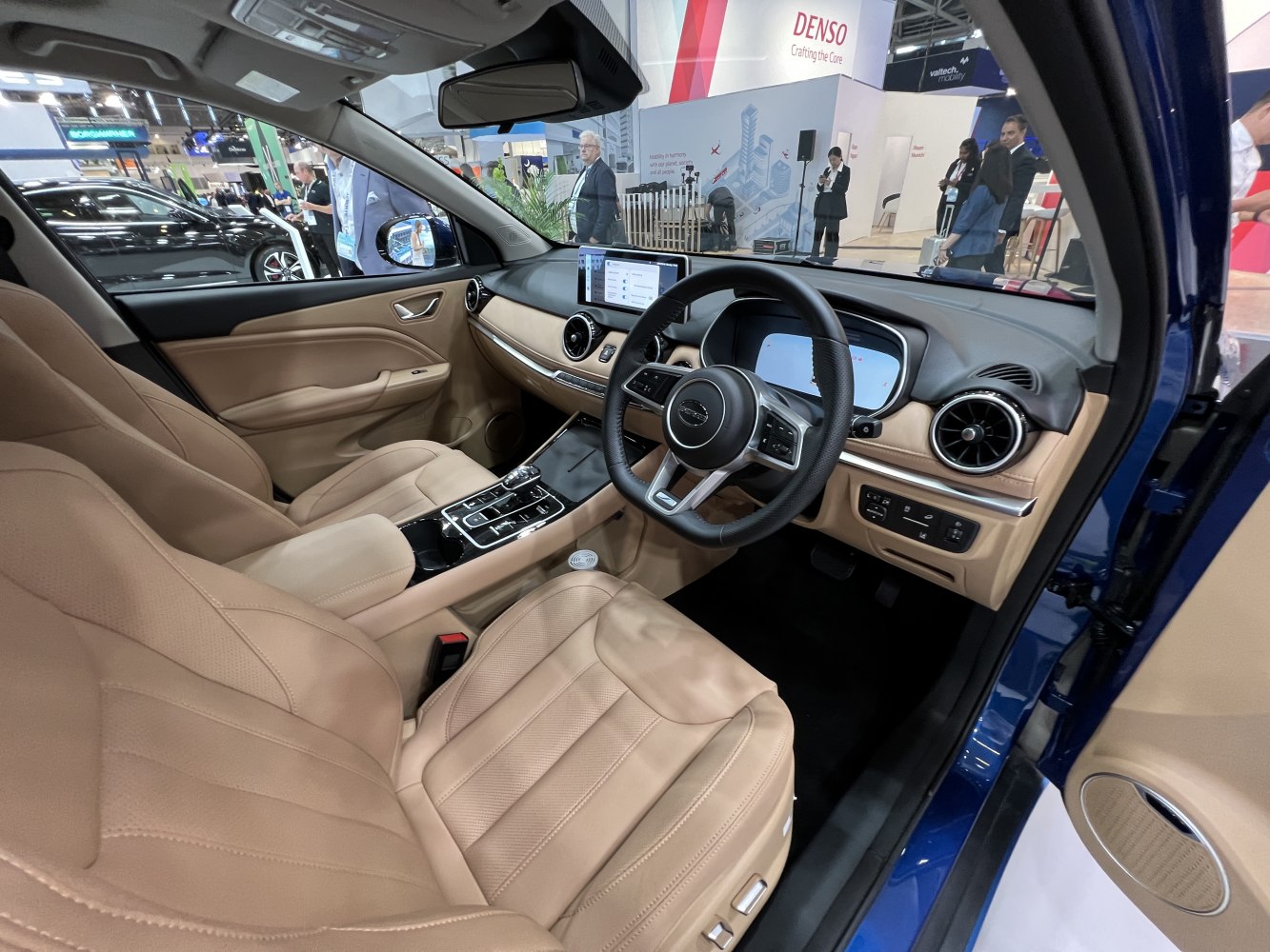 Beige leather interior with digital cluster and central touchscreen
