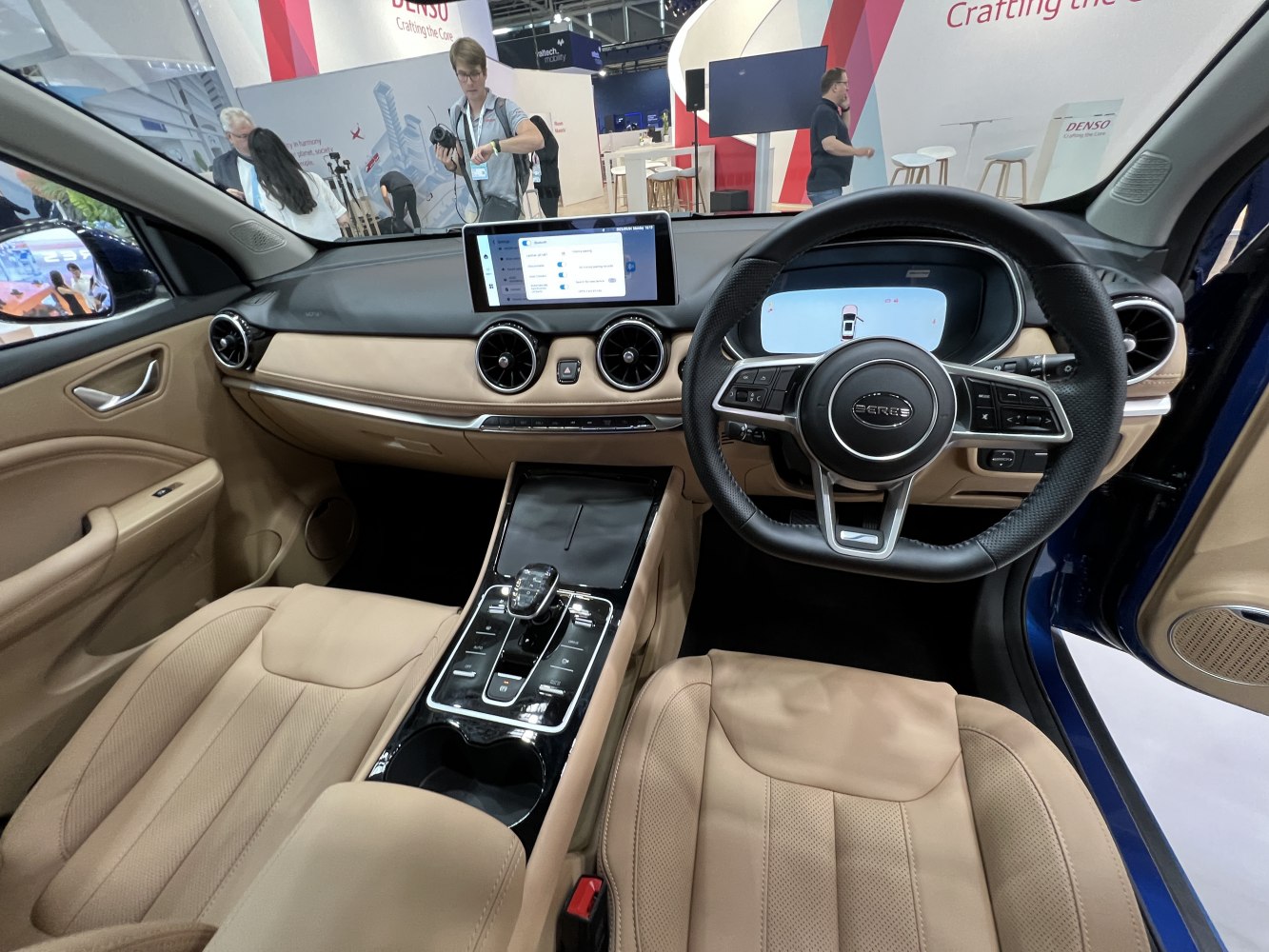 Beige leather interior with digital dashboard and touchscreen infotainment