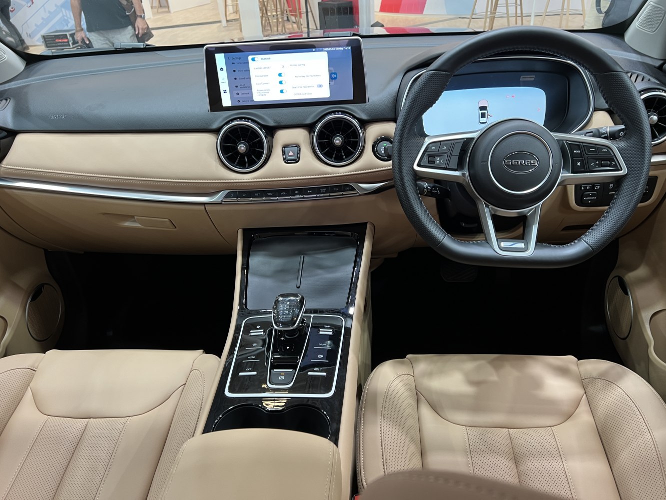 Digital instrument panel and touchscreen display with beige leather seats