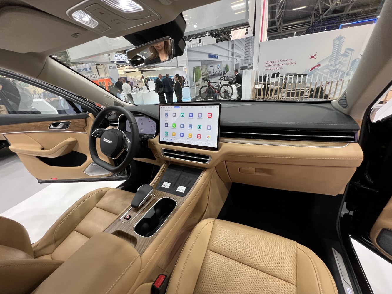 Modern car interior with large touchscreen and beige leather seats