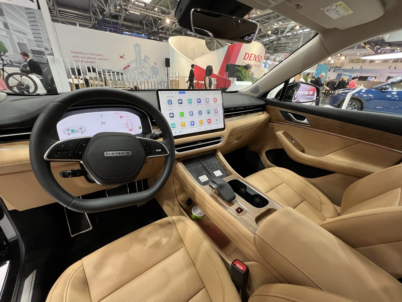 Digital instrument cluster and large touchscreen display in beige leather interior