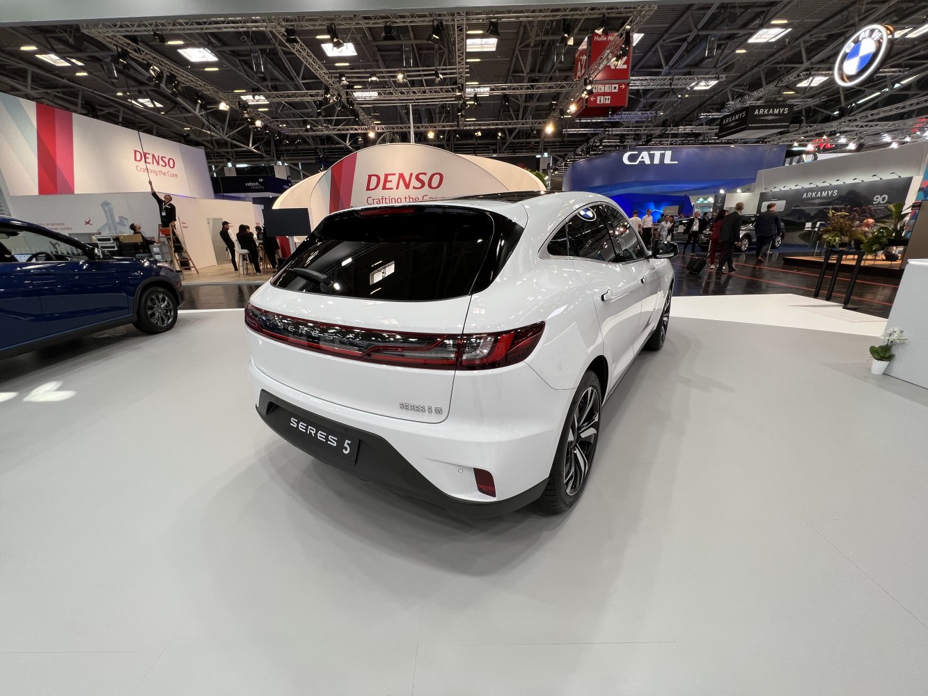 Rear view of a modern electric SUV with continuous LED taillights.