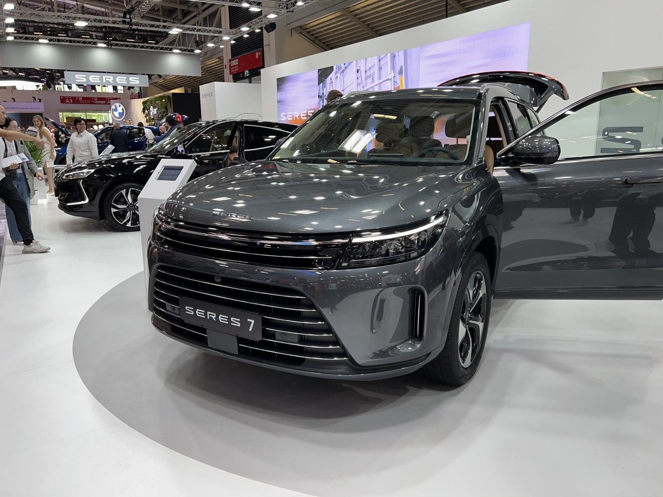 Front view of SUV with LED headlights and open front door
