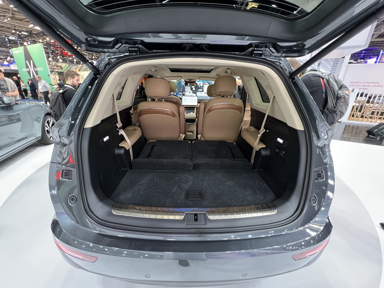Spacious SUV cargo area with folded rear seats and leather interior