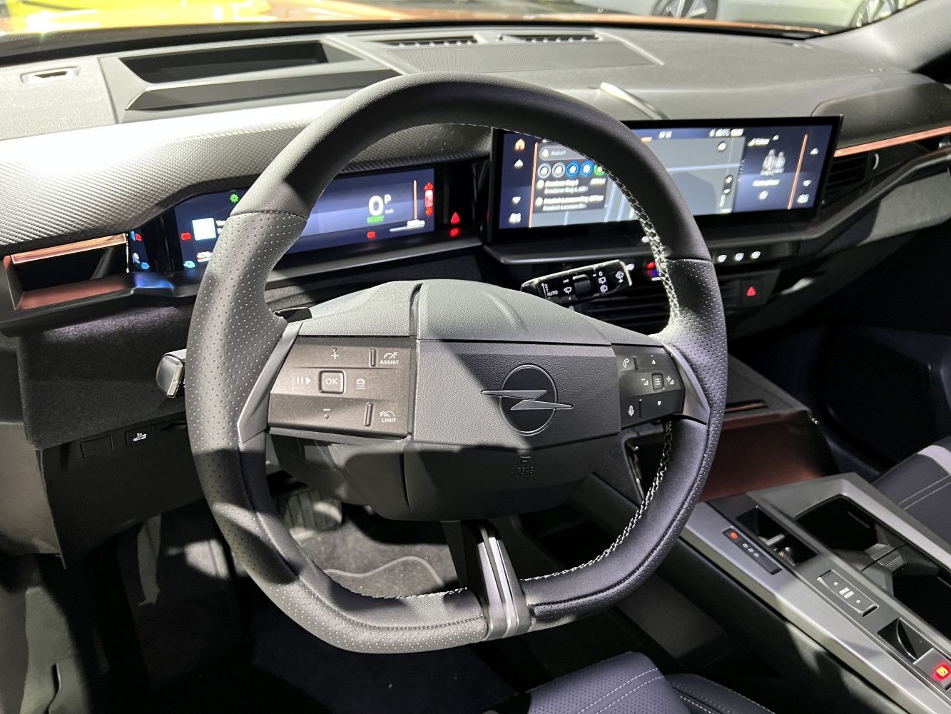 Multifunction steering wheel and dual digital dashboard display in car interior