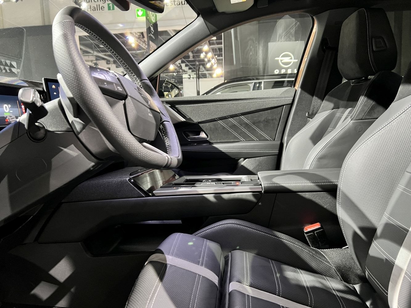 Steering wheel and front seats with detailed stitching and modern design