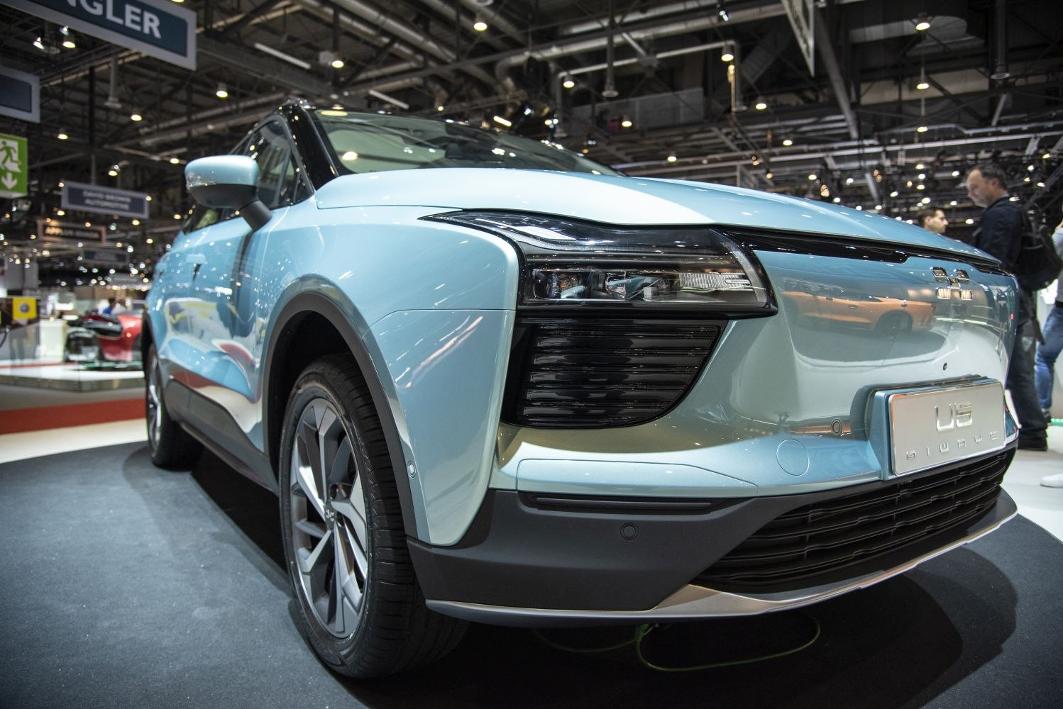 Close-up of aerodynamic front with futuristic multi-segmented headlights.