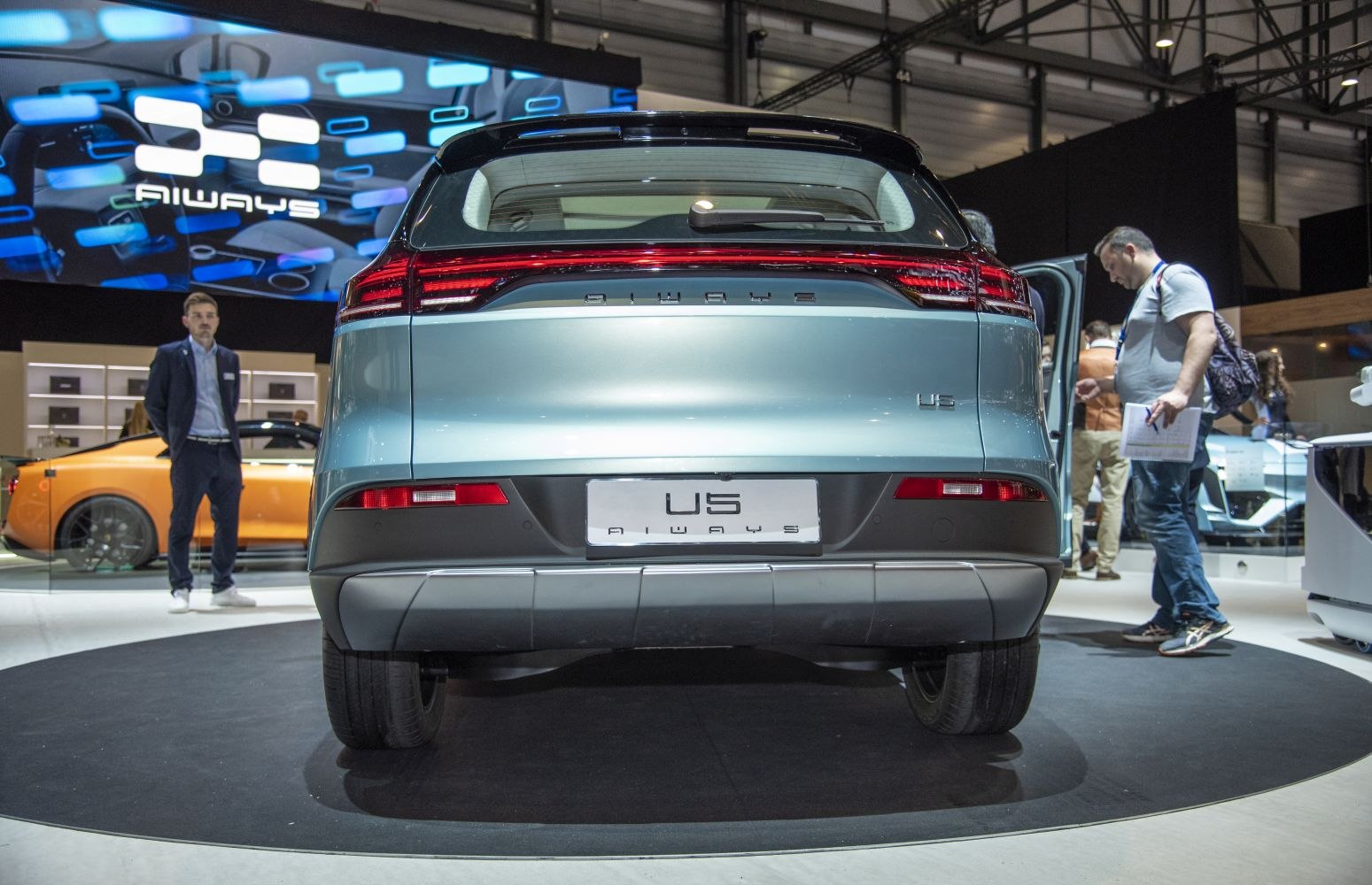 Rear view of a modern electric SUV with sleek horizontal taillights and rear diffuser