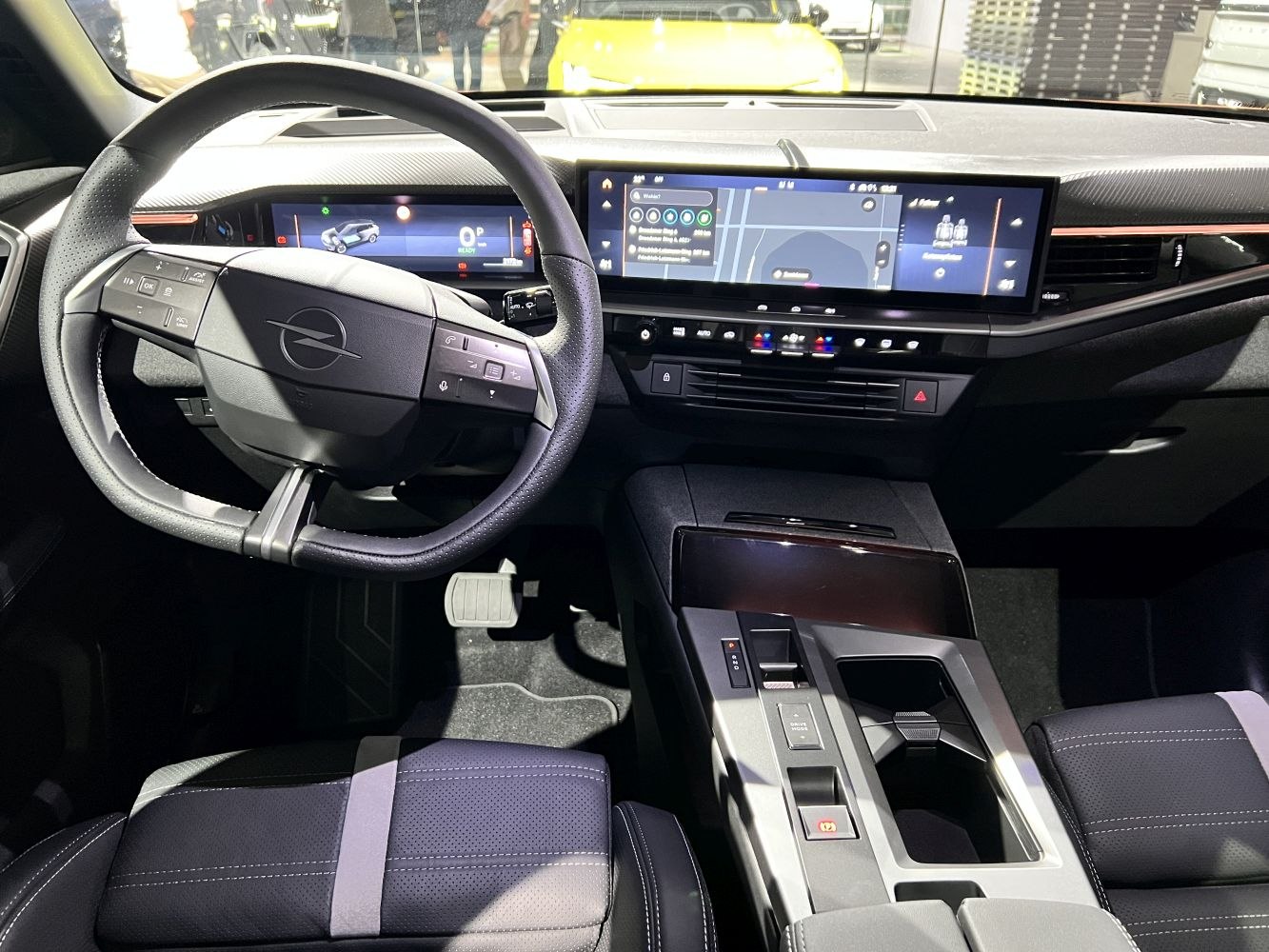 Modern digital dashboard and infotainment system with steering wheel controls