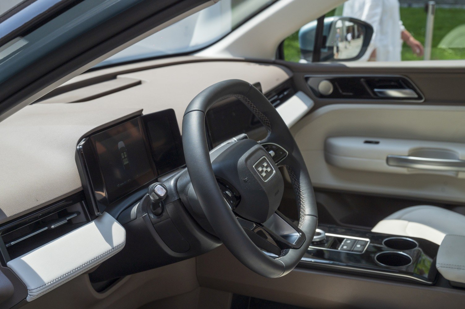 Modern steering wheel and digital dashboard in car interior
