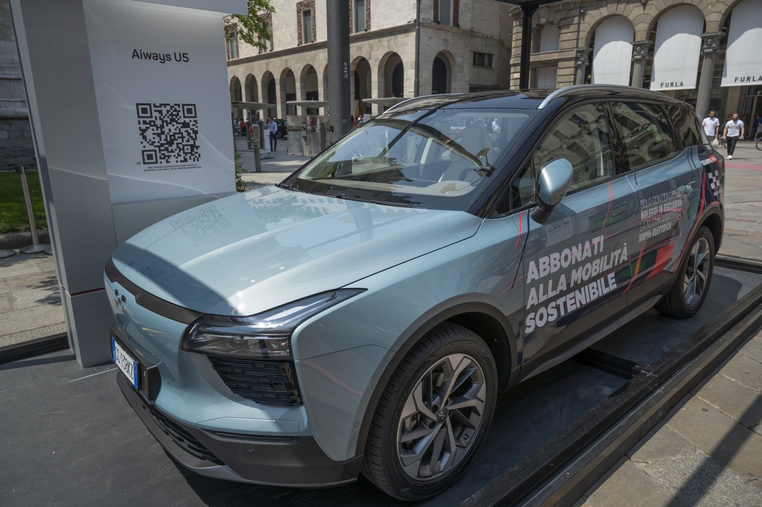 Front-side view of an electric SUV with alloy wheels and modern LED headlights