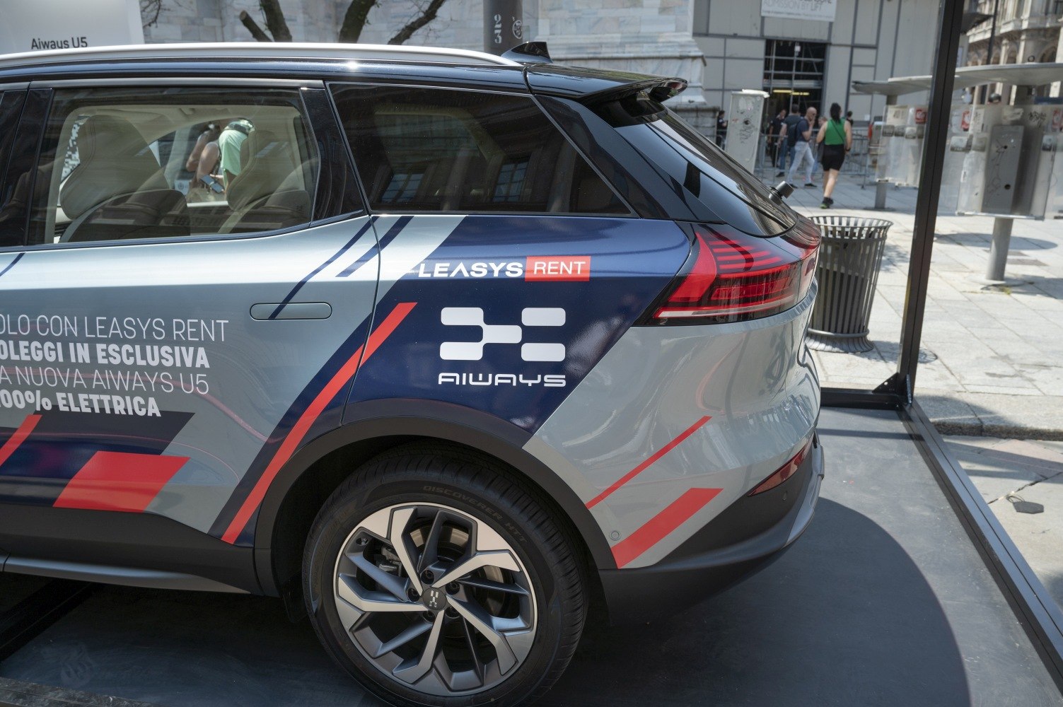 Rear and side profile of electric SUV with branded decals and modern taillights