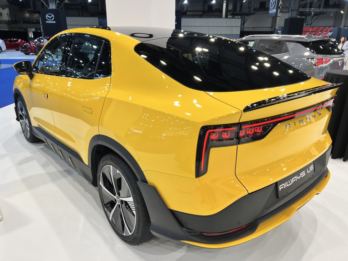 Rear and side view showing taillights and aerodynamic sculpted body
