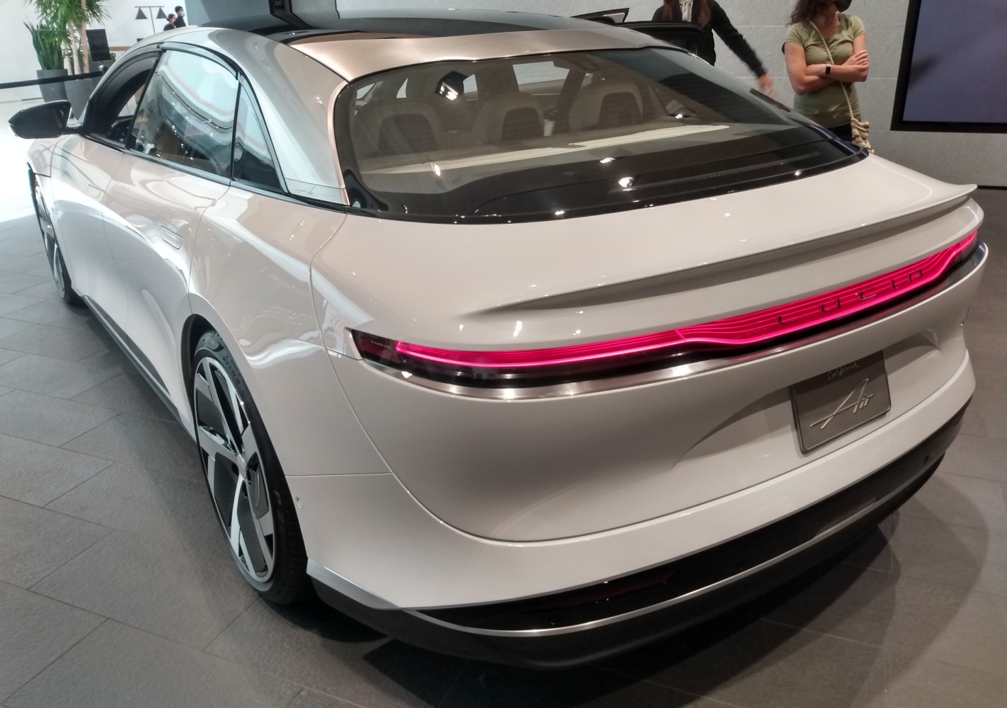 Sleek rear design with continuous LED taillights on electric sedan