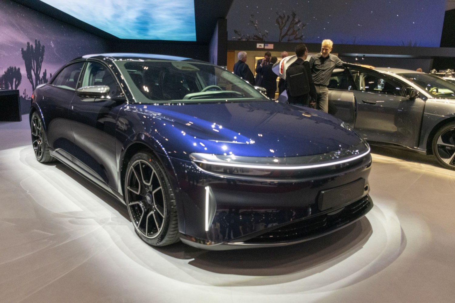 Sleek front with LED headlights and multi-spoke alloy wheels