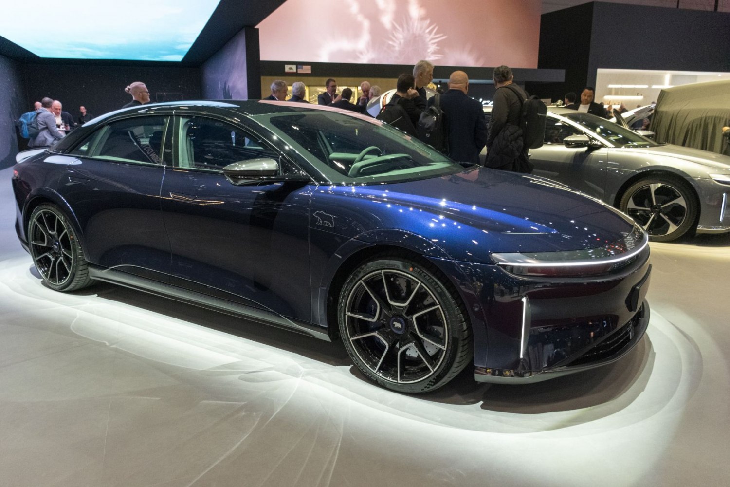Sleek electric sedan with distinctive LED front lights and aerodynamic styling