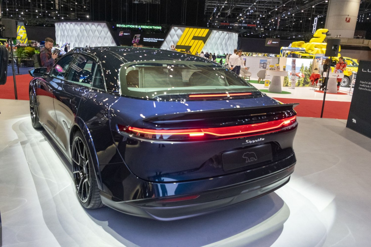 Rear view with continuous LED tail light strip and sporty spoiler
