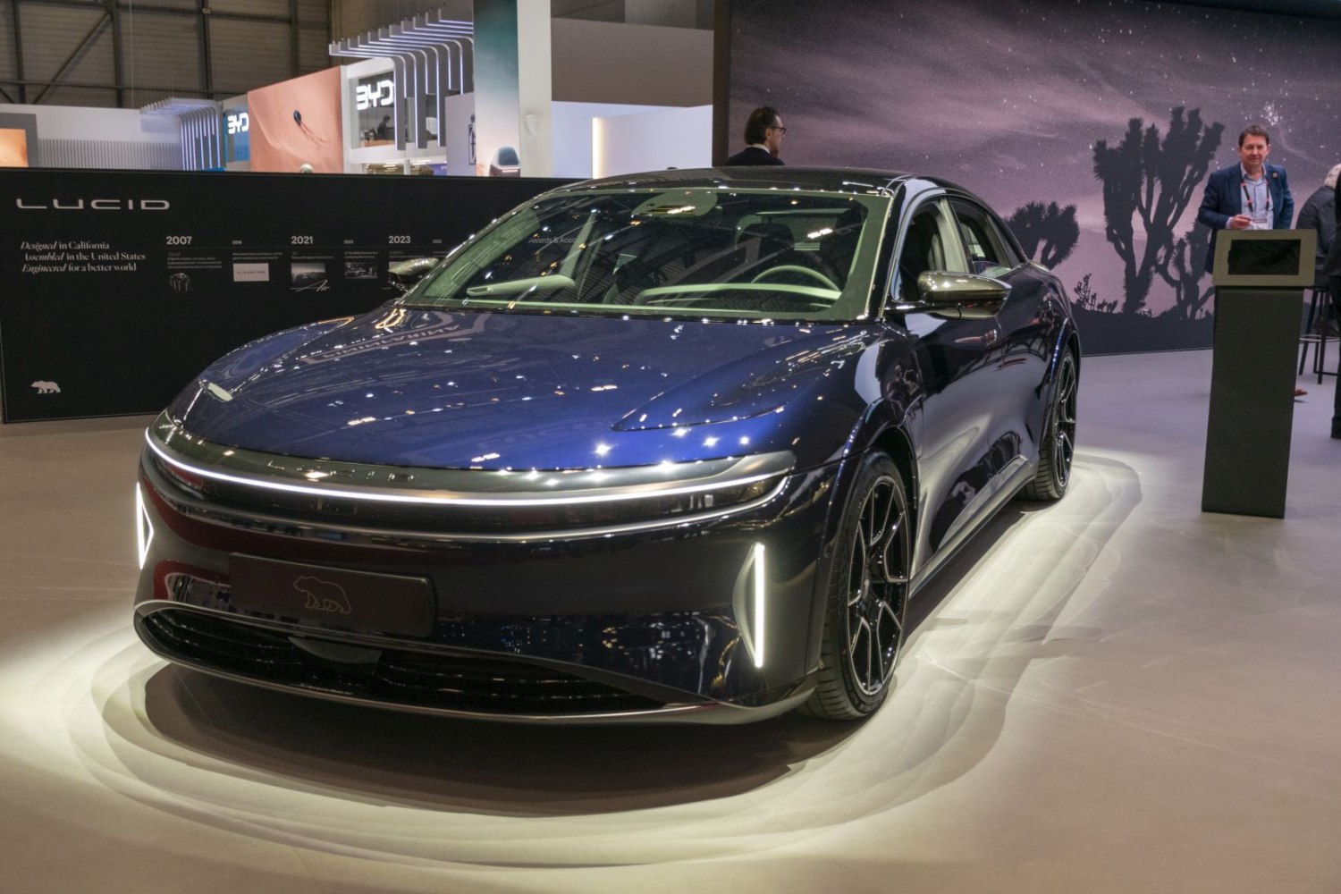 2022 electric sedan front with horizontal LED light bar and aerodynamic body