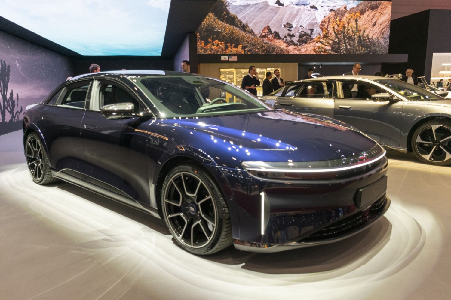 Blue electric sedan with aerodynamic body and LED lighting