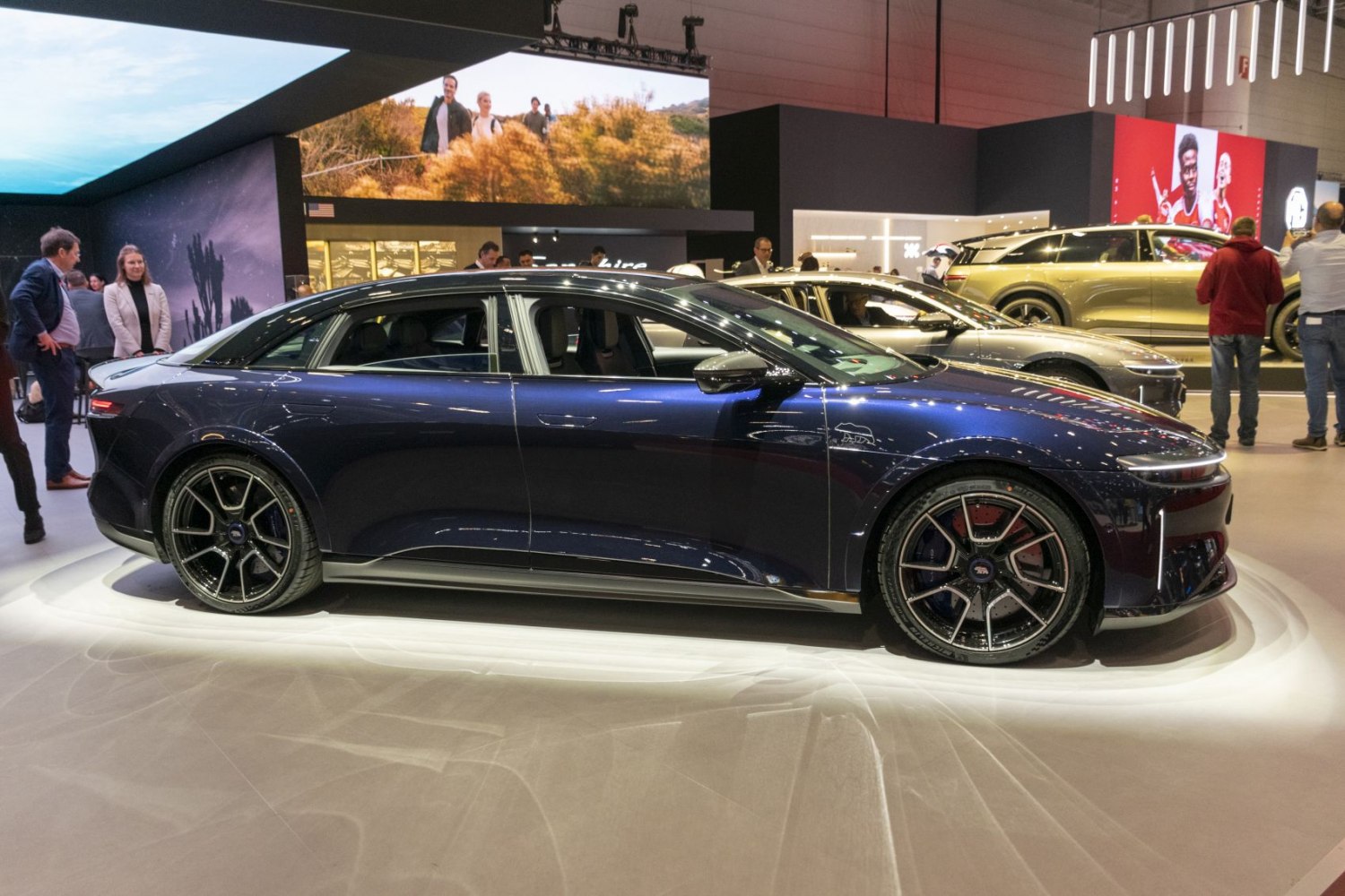 Sleek side profile with racing wheels of electric sedan