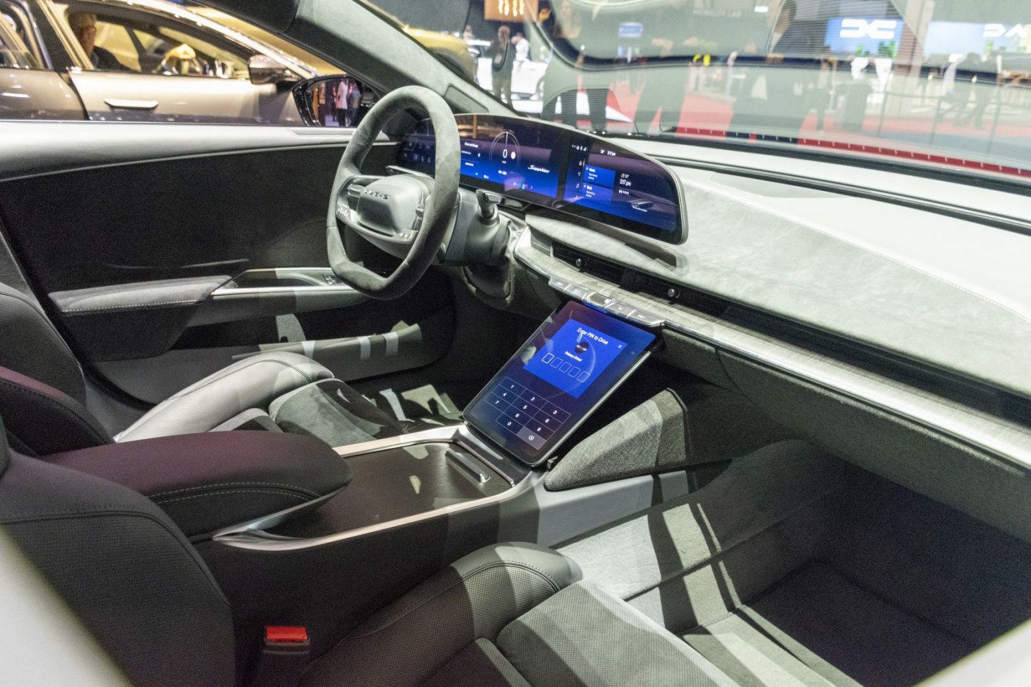 Digital dashboard and central touchscreen console in luxury electric sedan