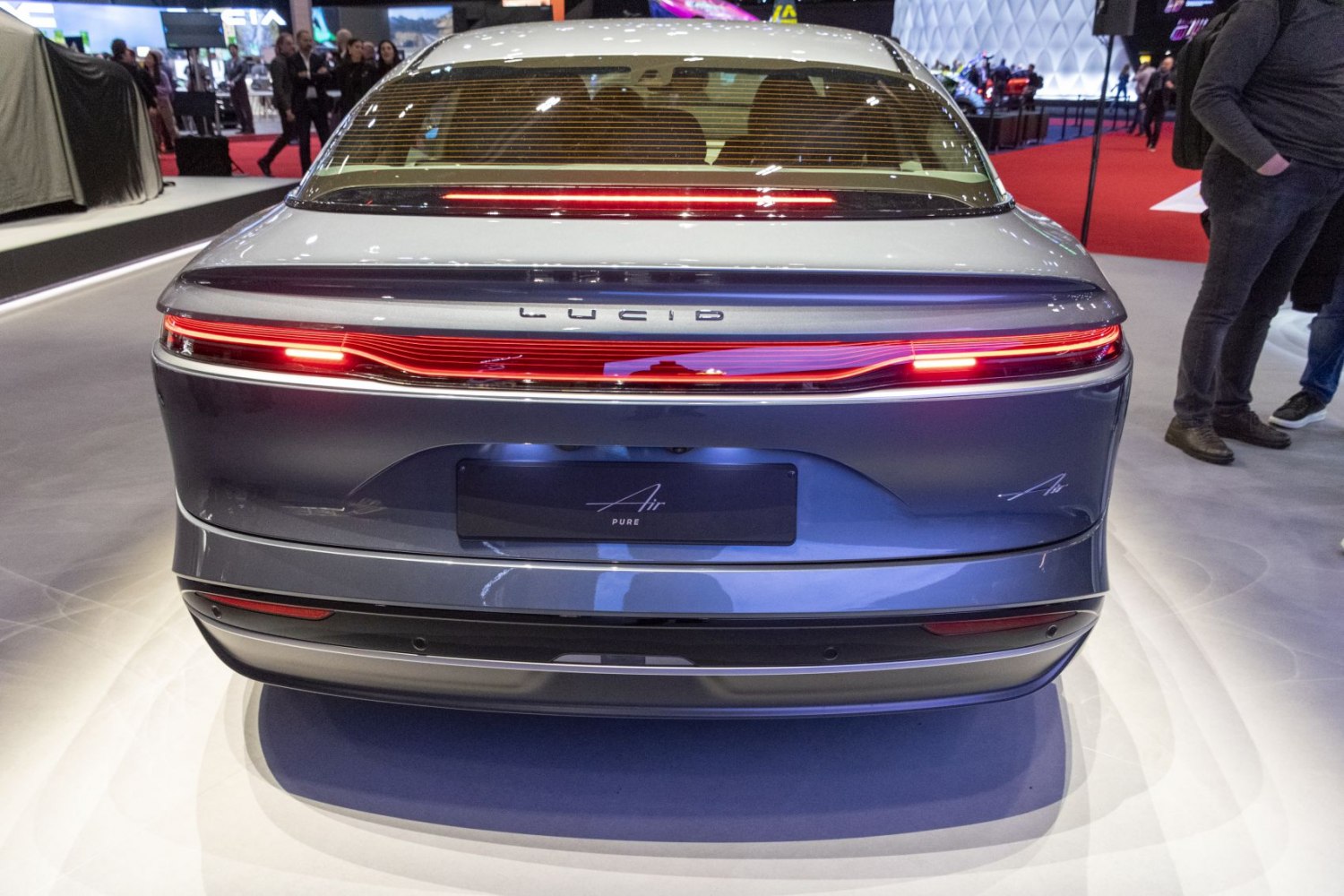 Sleek rear view with continuous LED light bar and aerodynamic design.