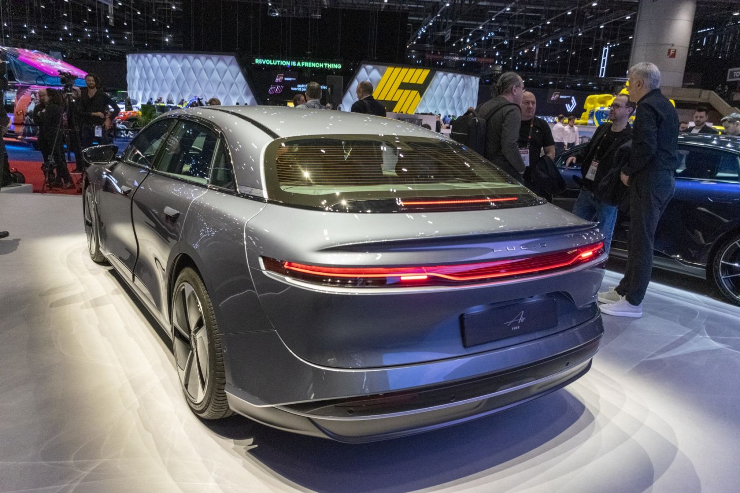 Rear view of a sleek sedan with continuous LED taillight strip.