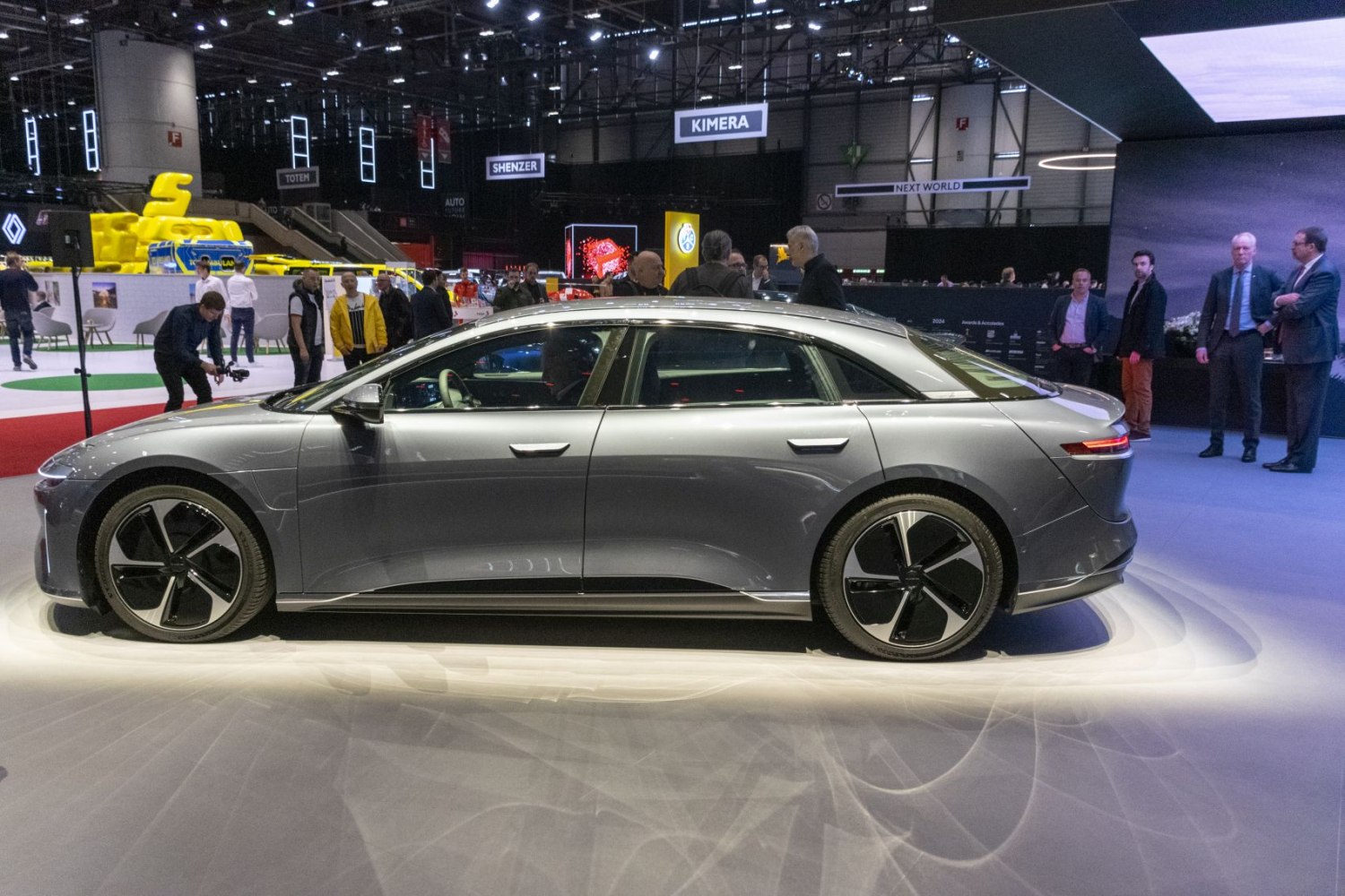 Aerodynamic electric sedan in silver with distinctive aerodynamic wheels