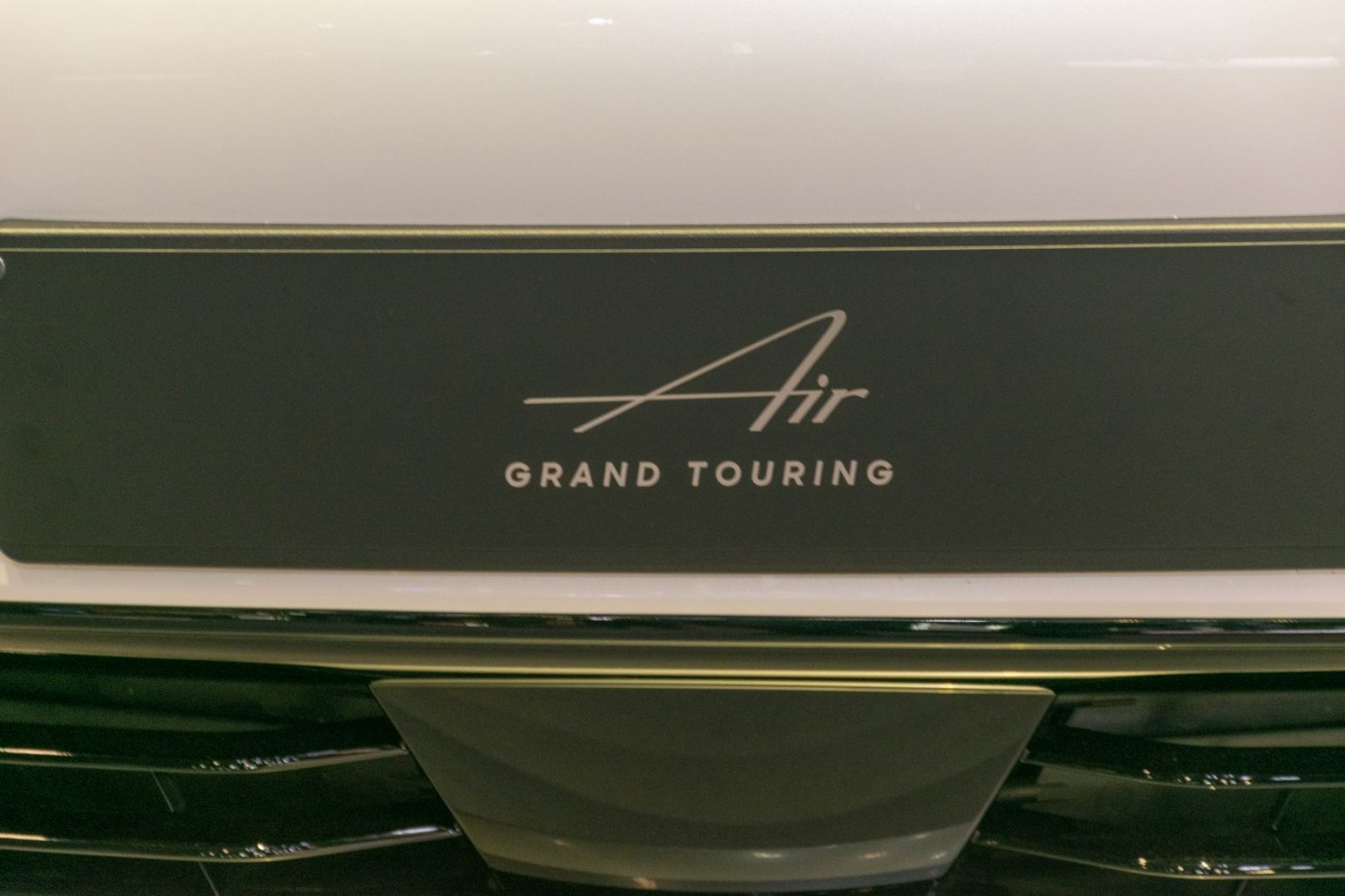 Close-up of Lucid Air Grand Touring model badge emblem